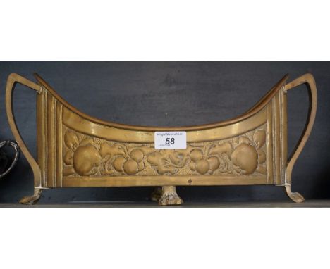 A highly decorative Art Nouveau brass planter having repousse decoration depicting fruit.