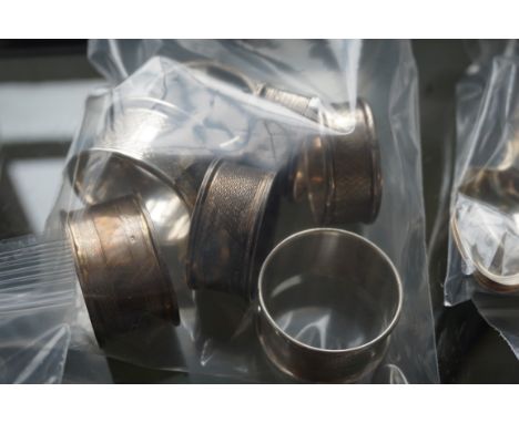 A mixed collection of seven various hallmarked silver napkin rings to include a Birmingham hallmarked engine turned example (