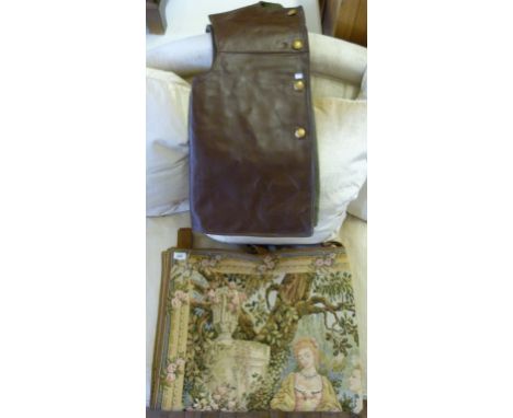 A vintage German jacket together with a tapestry wall hanging.