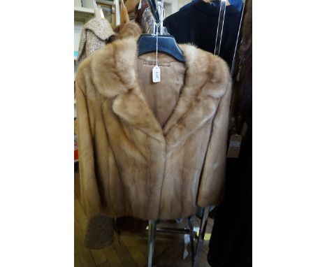 A Ladies blonde mink fur jacket, with light brown plain silk lining
