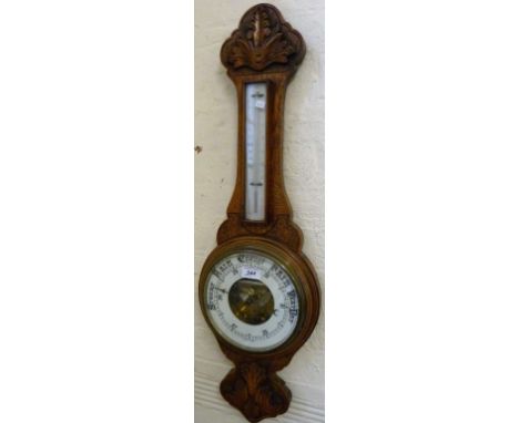 An early 20th Century oak aneroid barometer.