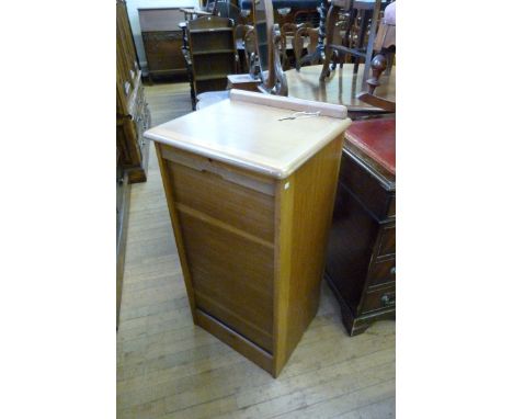 A good quality reproduction oak Abbess storage cabinet, with roller shutter door.