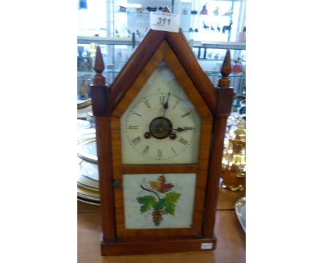 A mid 20th Century walnut cased American mantel clock.