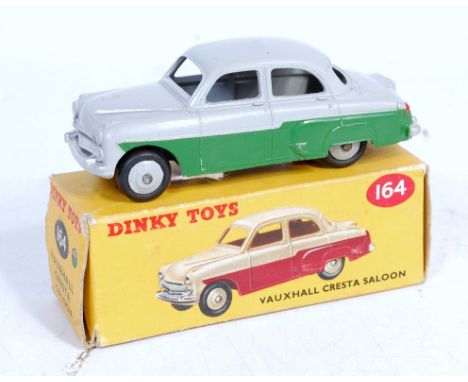 Dinky Toys, 164, Vauxhall Cresta Saloon, green and grey body with grey hubs, in the original correct colour spot box (VG-BVG)