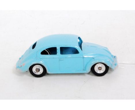 A Dinky Toys No. 181 VW saloon comprising light blue body with spun hubs and black tyres, fitted with chrome base plate, loos