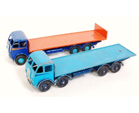 A Dinky Toys first type cab Foden playworn diecast group to include a No. 501 Foden flat truck comprising of light blue and d