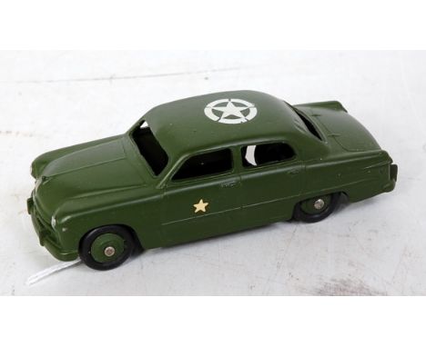 A Dinky Toys No. 139AM US Army staff car, Ford 4-door Sedan, comprising military green body with rigid hubs and white US star