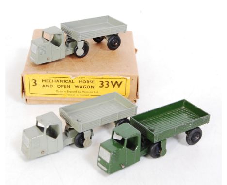 A Dinky Toys No. 33W mechanical horse and open wagon trade box containing three examples, two examples finished in grey, the 