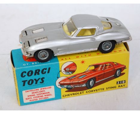 A Corgi Toys No. 310 Chevrolet Corvette Stingray comprising silver body with lemon interior and wire work hubs, in the origin