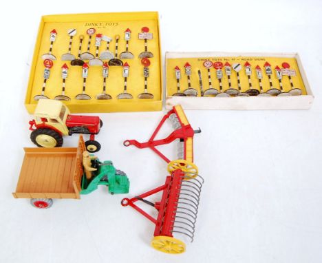 A collection of boxed and loose Dinky Toys farming vehicles and roadside accessories to include No. 342 motor cart, No. 322 d