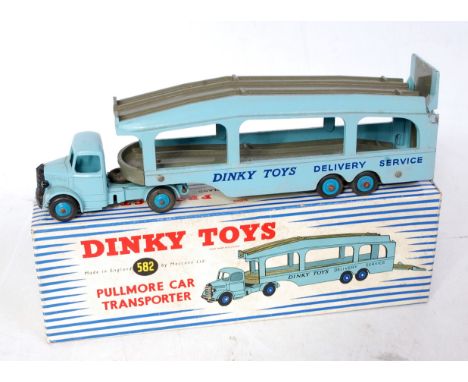 A Dinky Toys No. 582 Pull More Car Transporter comprising light blue body with grey decks and dark blue hubs, 4 rivet version
