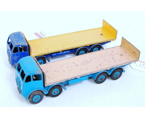 A Dinky Toys playworn No. 503 Foden flat truck diecast group, two examples to include a blue, yellow and light blue example, 