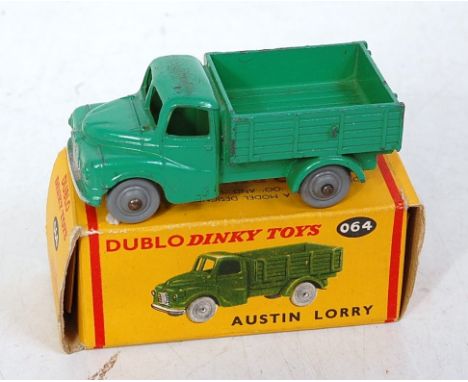 A Dinky Toys 00 No. 064 Austin lorry comprising of green body with plastic hubs in the original all-card box, model is playwo