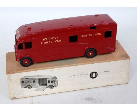 A Dinky Toys No. 581 horsebox comprising maroon body with maroon hubs and express horse van and higher service decals, US exp