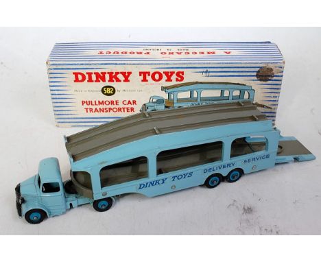 A Dinky Toys No. 582 Pull More Car Transporter, comprising of light blue body with mid blue hubs and grey decks, 6 rivet vers
