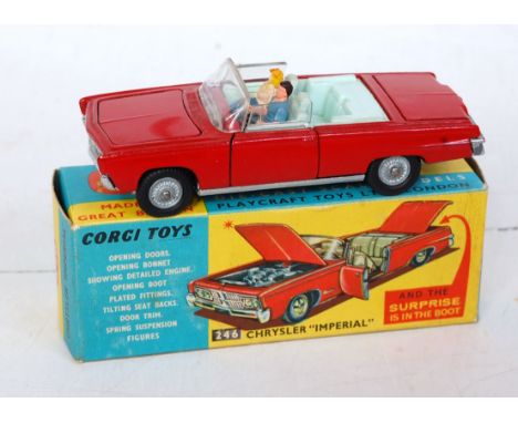 A Corgi Toys No. 246 Chrysler Imperial comprising red body with light blue interior and two figures, with golf trolley in boo