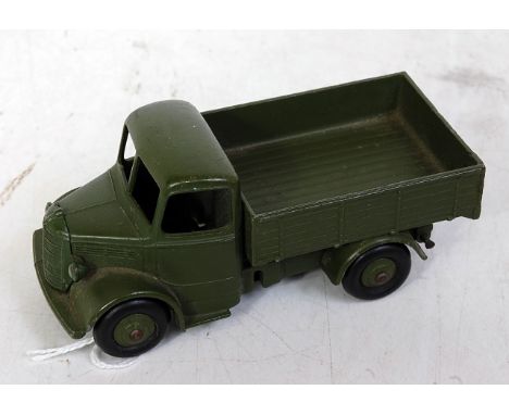 A Dinky Toys No. 25WM Bedford open back military truck comprising military green body with rigid hubs and black smooth tyres 