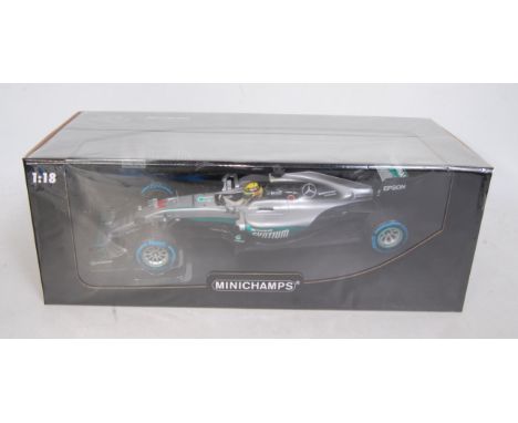 A Minichamps 1/18 scale model of a Mercedes AMG Petronas Motorsport F1 racing car, W07 Hybrid, Lewis Hamilton, winner Brazili