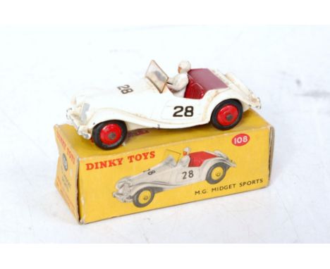 A Dinky Toys No. 108 MG Midget Sports comprising of light cream body with maroon interior and red hubs with driver figure, in