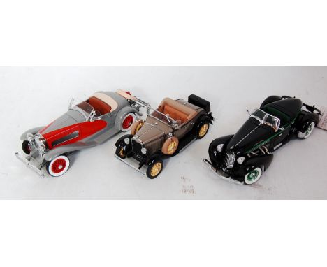 Three various boxed 1/24 scale Franklin Mint diecasts to include a 1935 Aubyn 851 Speedster, a 1935 Dusenberg SSJ, and a 1931