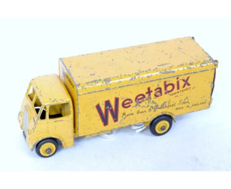 A Dinky Toys No. 514 Weetabix Guy van comprising yellow body with yellow hubs and Weetabix livery, playworn example (G)