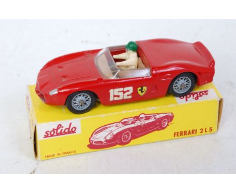 A Solido No. 129 Ferrari 2 L5 racing car, comprising red body with racing No. 152 and wirework figure hubs and driver figure,