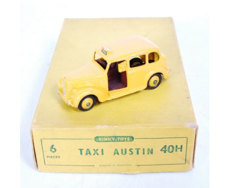 A Dinky Toys trade box No. 40H Austin taxi, containing one No. 40H Austin taxi example, finished in yellow with brown interio