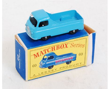 A Matchbox 1/75 series No. 60A Morris J2 pickup comprising light blue body with black plastic wheels, cast rear window, oppos