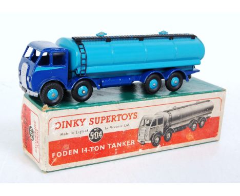 A Dinky Toys No. 504 Foden 14 Ton tanker comprising of first type cab with dark blue and light blue two-tone body with light 