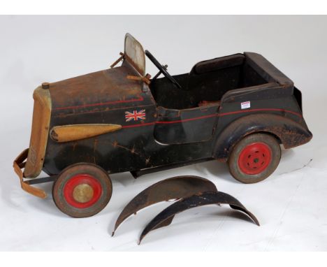 An early 20th century Triang large pressed steel and metal pedal car comprising dark blue body with red domed hubs, fitted wi