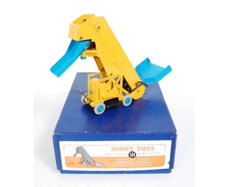 A Dinky Toys No. 564 elevator loader comprising of yellow and blue body with blue hubs in the original all-card box (VG,BVG)