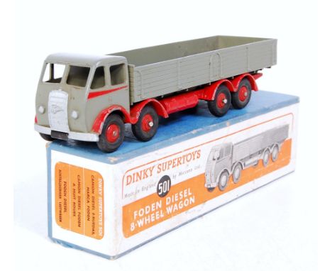 A Dinky Toys No. 501 Foden diesel 8-wheel wagon comprising of first type cab finished in dark grey and red with red hubs, in 