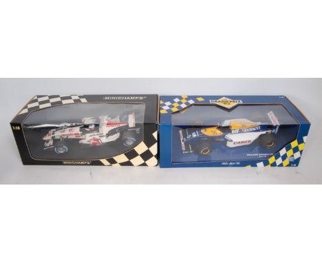 A Minichamps boxes 1/18 scale F1 racing car group to include a Honda racing F1 team RA106 Jenson Button 2006 racing car, toge