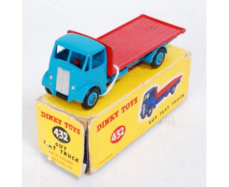 A Dinky Toys No. 432 Guy flat truck comprising of rare bright blue cab and chassis with red back and light blue hubs in the o