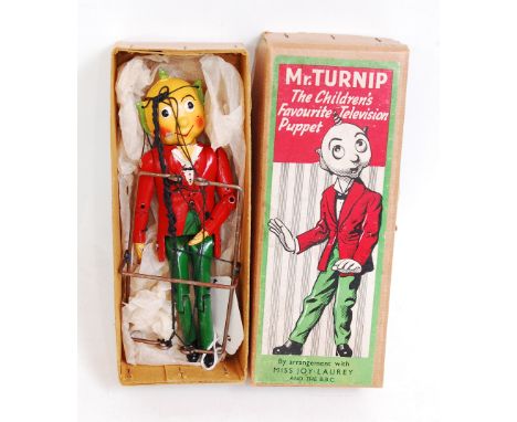 A Mr Turnip puppet taken from the BBC television series, finished in red, green and yellow, in original all-card box with col