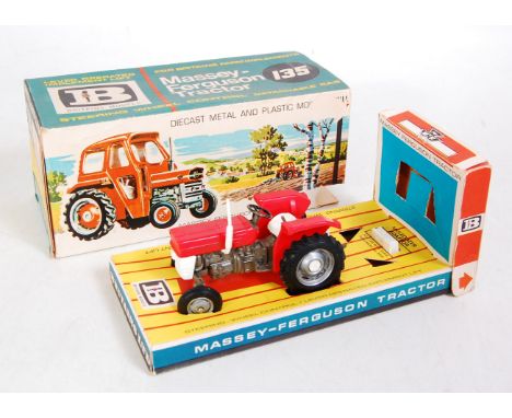 A Britains No. 9529 Massey Ferguson 135 tractor comprising grey, red and white body, with silver hubs, in the original slidin