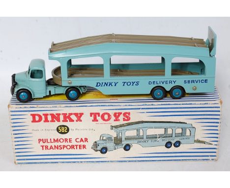 A Dinky Toys No. 582 Pull More Car Transporter comprising light blue body with mid-blue hubs and grey deck, four rivet versio