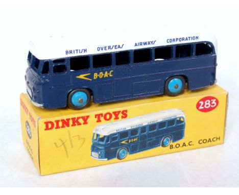 A Dinky Toys No. 283 BOAC coach comprising dark blue &amp; white body with light blue hubs, in the original all-card box (VG,