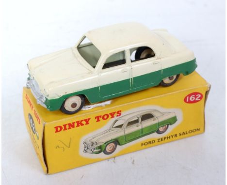 A Dinky Toys No. 162 Ford Zephyr saloon comprising cream upper body with green lower, and cream hubs, in the original correct