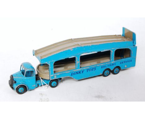 A Dinky Toys No. 582 Pull More Car Transporter comprising dark blue rare body with grey decks and matching blue hubs, model i