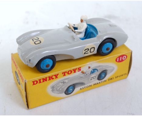 A Dinky Toys No. 110 Aston Martin DB3 sports car comprising grey body with blue interior and blue hubs, racing No. 20, with d