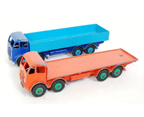 A Dinky Toys playworn Foden second type cab diecast group to include a No. 902 Foden flat truck comprising orange body with g