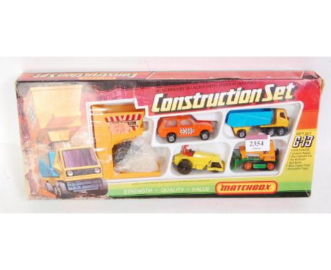 A Matchbox No. G3 construction gift set comprising five various vehicles, granule hopper, and coal load, all housed in the or