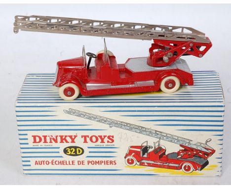 A French Dinky Toys No. 32D Auto-Echelle De Pompiers, comprising red body with silver detailing and silver ladder and white t