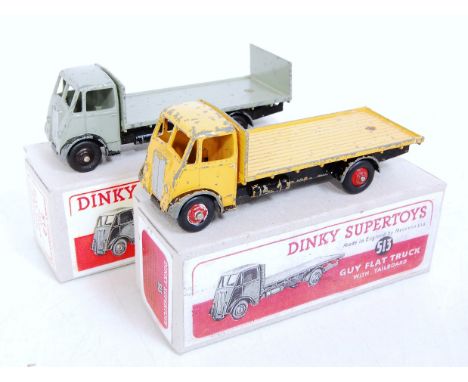 A Dinky Toys reproduction boxed Guy flat truck group to include No. 512 Guy flat truck finished in yellow and black with red 