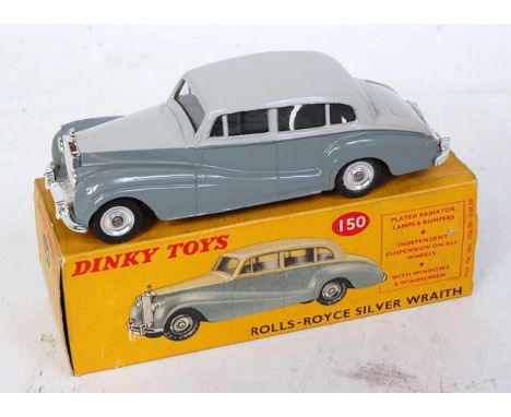 A Dinky Toys No. 150 Rolls Royce Silver Wraith comprising two-tone grey body with spun hubs and clear glazing in the original