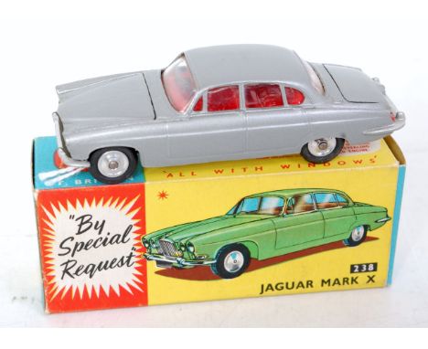 A Corgi Toys No. 238 Jaguar Mk X, comprising silver body with red interior and spun hubs, with two pieces of luggage in boot,