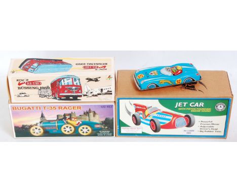 Four various boxed and loose tinplate related items to include a Schylling Collectors Series Jet car, a Chinese Bugatti T35 R