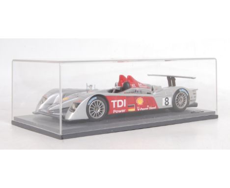 A Le Mans Miniatures by Minimax 1/24 scale diecast model of an Audi R10 TDI Le Mans 2006 winner, finished in silver and red w