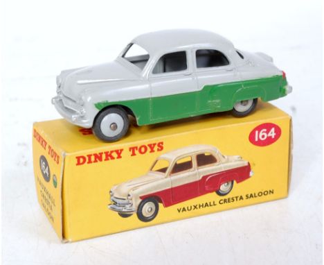 A Dinky Toys No. 164 Vauxhall Cresta saloon comprising grey and green body with grey hubs, in the original correct colour spo